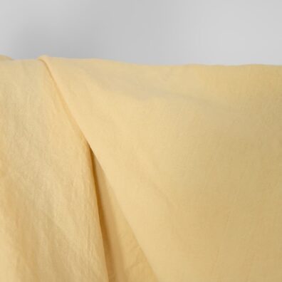 Halvlin stoff gulaktig vasket, 145cm bredt